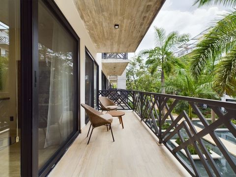 Enjoy a spacious balcony adorned with wooden chairs and lush finishes, perfect for serene moments or enjoying your morning coffee.