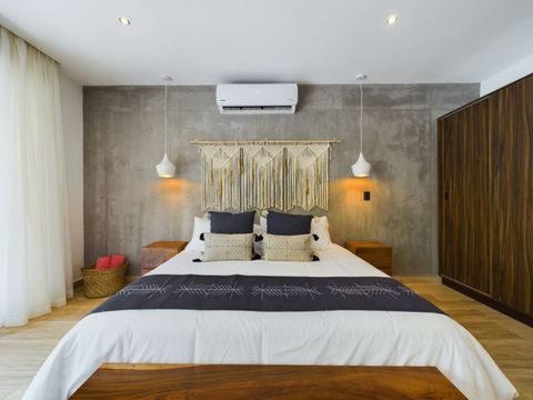 Stylish Retreat: Experience modern elegance with a chic king-size bed and artistic decor!