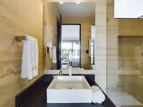 Pamper yourself in the master bathroom, equipped with a roomy rain shower, a separate toilet space, and a generously sized sink a haven of relaxation.