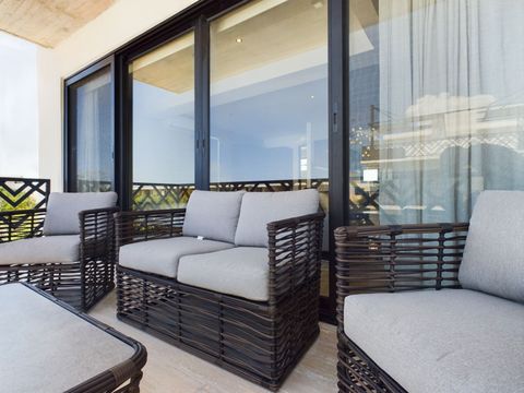 Experience beautiful vistas and serene moments on our balcony featuring charming chairs a serene setting to bask in the views and create cherished memories.