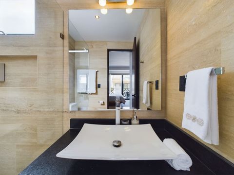 Discover exquisite bathrooms boasting sophisticated, elegant finishes. Embrace luxury and charm in these beautifully designed spaces, perfect for unwinding in style.