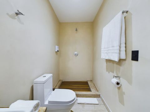 Immaculate bathroom offers contemporary elegance and all amenities for a comfortable and enjoyable experience.