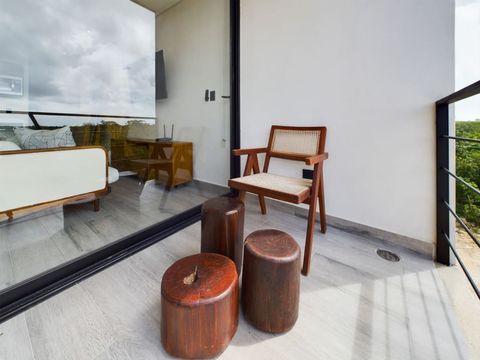 Right in front of the living space you will find a private balcony with a stair case leading to the rooftop. This is the perfect space to hang out and grab a coffee