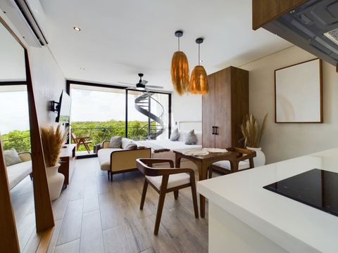 The living space is wide opened and very bright. This is the view of the space as you walk in apartment 304 at Chaac Tulum.