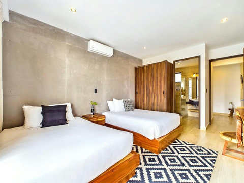 The master bedroom is equipped with two double beds which can sleep 4 people in total. In total this apartment can easily accommodate 6 people. You will also appreciate the extra storage space available with multiple closets.