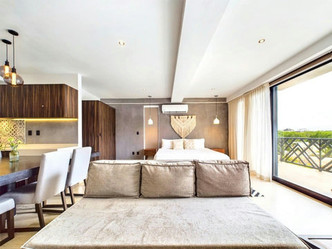 In the living room we also have a double sofa bed which can sleep extra people if needed. This will also be a cool spot to relax after a long beach day, the space can be opened completely with the large windows facing the Palais gardens.