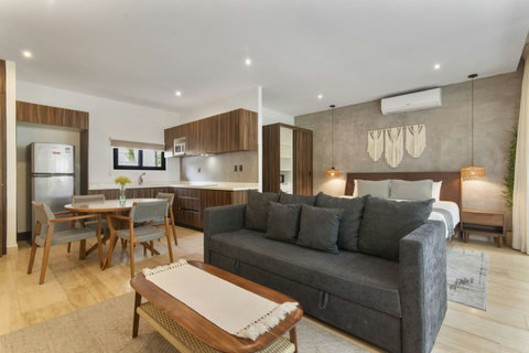 The wide-open lounge area is perfect for hanging out with friends or family, offering plenty of room to relax and enjoy each other's company.