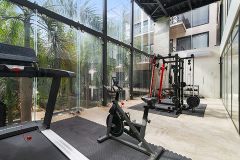 Stay on top of your fitness game in our fully equipped gym, featuring state-of-the-art machines and free weights for all your workout needs! #FitnessGuru
