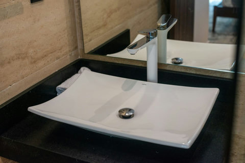 Experience luxury with our stylish bathroom faucet, paired with plenty of storage space, ensuring all your essentials are conveniently at hand for a perfect stay.