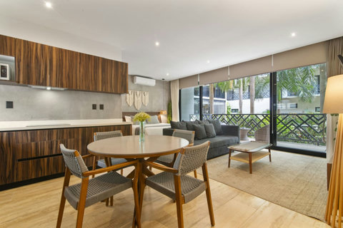 Enjoy meals around a spacious dining table that comfortably seats four, making it ideal for family meals or gatherings with friends.