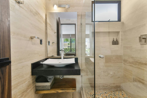 Our bathrooms feature ample storage space underneath the sink, ensuring you have everything you need right at your fingertips.