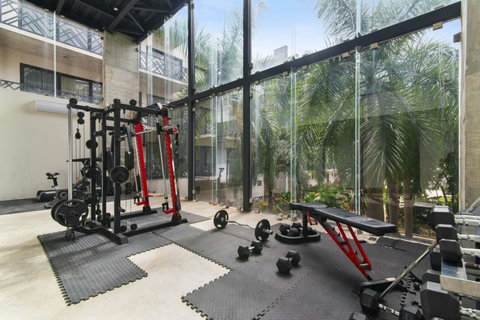 Stay on top of your fitness game in our fully equipped gym, featuring state-of-the-art machines and free weights for all your workout needs! #FitnessGuru