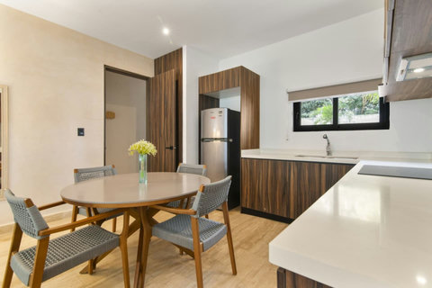 With plenty of natural light and a clean, neat design, the kitchen and dining area invite you to relax and enjoy home-cooked meals in style.