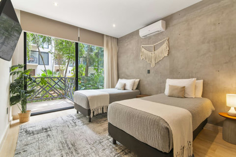 With the option of two individual beds and extra amenities, our second bedroom is tailored to meet your vacation needs.