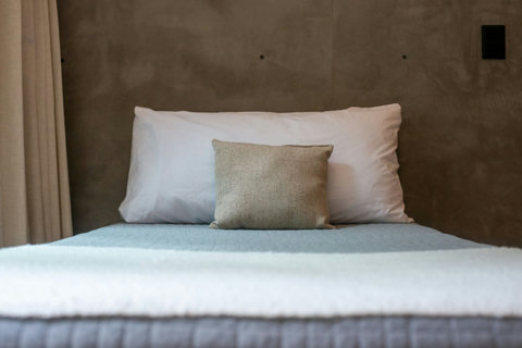 Soft textures and cozy layers make this twin bed the perfect spot to rest and recharge after a day of exploring.