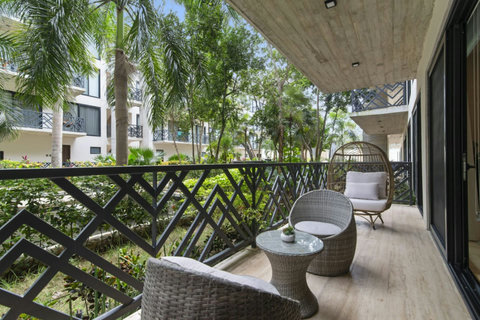 Relax on your private terrace, offering peaceful views of the garden, making it the perfect spot to unwind with a book by your side!