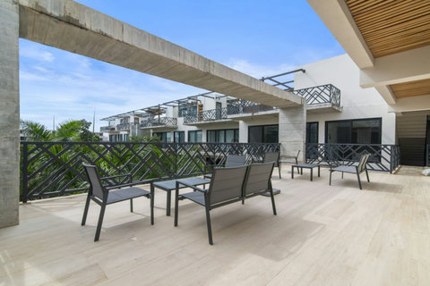 Relax in style on our shared terraces, complete with sunbeds and seating areas, designed for comfort and leisure in the heart of Tulum.