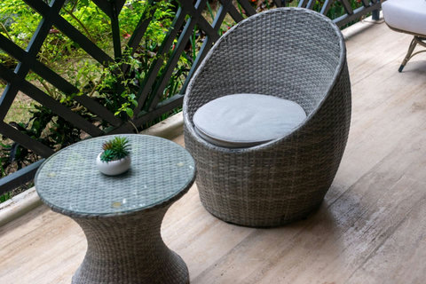 Experience true relaxation on the terrace with stylish chairs and a vast view of the lush garden, perfect for peaceful moments and quiet reflection.