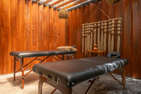 Cool off and unwind in the shared plunge pool, a refreshing escape surrounded by tropical greenery and relaxation areas.