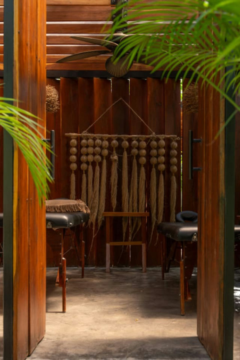 Relaxing massage area just steps from your door. Enjoy a peaceful, open-air space with cozy massage tables, warm wooden accents, and soft lighting