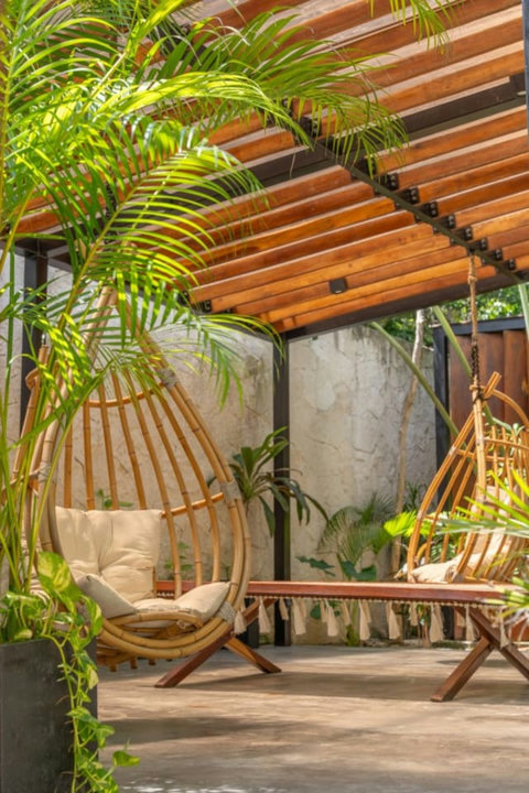 Perfect for morning coffee or evening cocktails, this cozy space brings you close to nature with lush greenery all around.