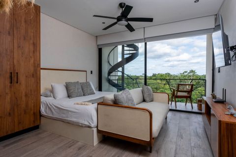 Our living room is designed for comfort and style, featuring chic furnishings and natural light. Enjoy cozy evenings or entertaining friends in this exquisite space. Your Tulum adventure starts here!