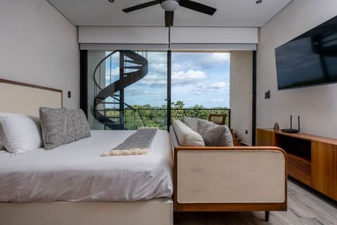Sleep like a king or queen in our elegant bedroom featuring luxurious bedding and serene decor. Your peaceful getaway awaits in Tulum—where comfort meets sophistication. Don’t miss out!