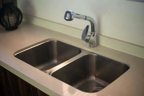 The kitchen is equipped with a clean, functional sink for your convenience during your stay.