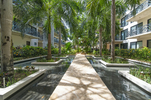 Step inside the courtyard to discover serene shared gardens with lush trees. We keep all common areas in top condition to ensure a peaceful, welcoming stay.