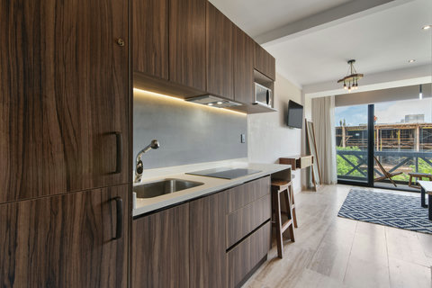 Prepare your favorite meals in this fully equipped kitchen, where modern design meets inviting charm—perfect for relaxed mornings or dinners at home.