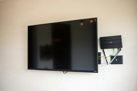 Enjoy your favorite shows and movies on a sleek flat-screen TV—perfect for relaxing after a day of adventure.