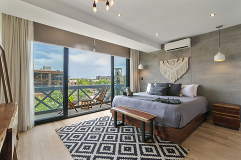 Retreat to the master bedroom—a serene haven with a spacious bed, perfect for unwinding in comfort and elegance.