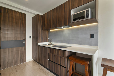 Step into a stylish kitchen with modern appliances, cozy decor, and everything you need to prepare delicious meals during your stay.