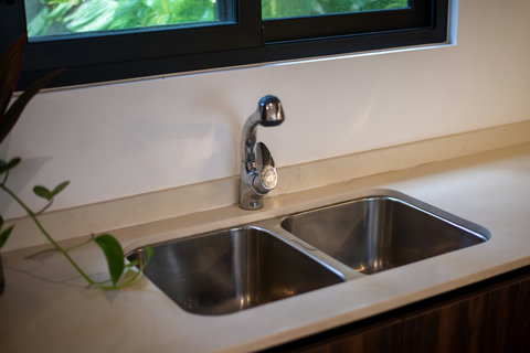 Practical double sink with a modern faucet—ideal for easy cooking and cleanup.
