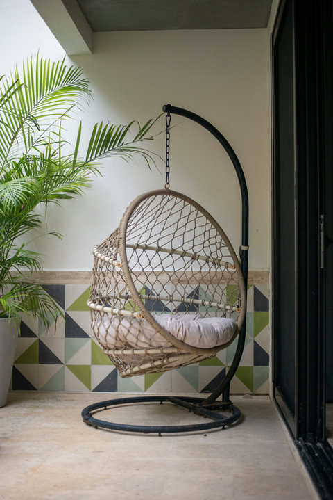 Swing into serenity in this comfy hanging chair, perfect for reading or morning coffee.