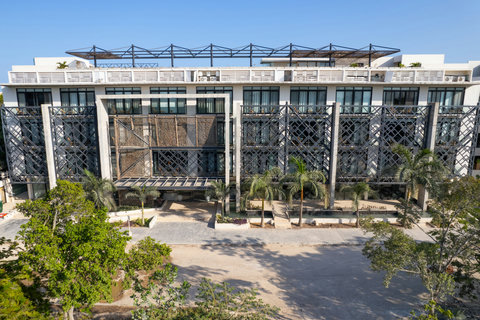 Sleek architecture, metal accents, and palm trees define this modern building—offering stylish, comfortable living in a prime and well-kept location.