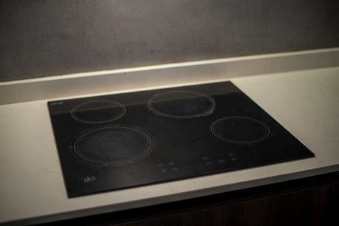 Our kitchen features modern appliances like a stove and microwave—everything you need for a comfortable cooking experience!
