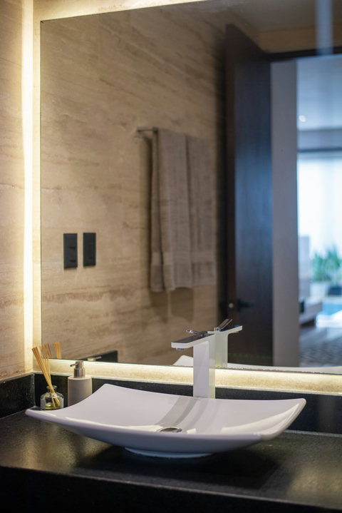 Modern sink design with clean lines, soft lighting, and spa-like details.