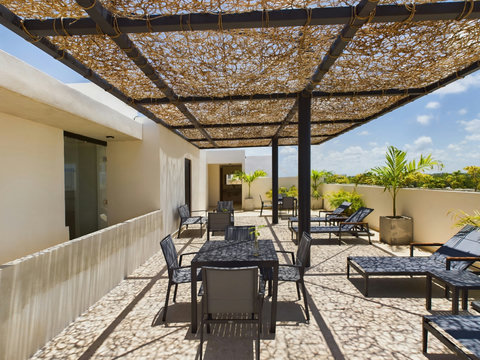 Enjoy shaded sunbeds and shared tables available for all guests. The rooftop offers cozy spots to relax, socialize, and enjoy with friends or family.