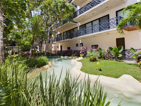 Discover a peaceful retreat where lush gardens blend with striking design—perfect for those seeking calm and connection with nature.