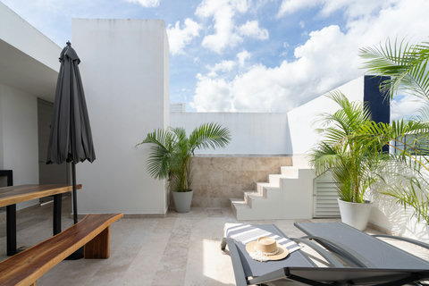 Wake up to your own tropical retreat featuring a private pool, sun loungers, and breakfast table. Palm trees and gentle breezes create the perfect setting for relaxation and comfort.