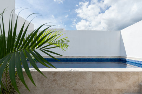 Unwind in your own private plunge pool, surrounded by minimalist design and natural stone finishes—an intimate spot to cool off and relax under the open sky.