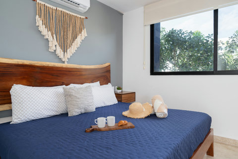 Experience ultimate comfort on a beautiful king-size bed with premium linens, soft pillows, and elegant wood accents—perfect for restful nights and peaceful mornings.