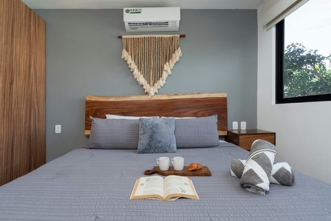 Relax in style on a stunning king-size bed featuring elegant wooden details, high-quality linens, and cozy pillows—crafted to ensure deep rest and a refreshing start to your day.