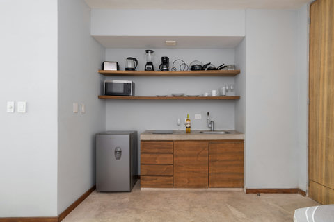 Bright and modern studio with a fully equipped kitchenette, warm décor, and everything you need for a comfortable and relaxing stay.