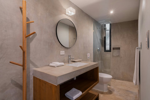 Enjoy a charming, inviting bathroom with a refreshing shower, sink, and toilet. Designed for comfort and ease, it’s an ideal space to refresh and relax during your stay