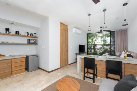 This airy studio features a comfortable sofa, dining area, and large windows that fill the space with light. Enjoy fast Wi-Fi and thoughtful décor, creating a perfect setting for a relaxing and enjoyable stay.