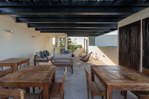 Enjoy a welcoming rooftop lounge featuring comfortable chairs and convenient tables right beside the pool. It’s the perfect spot to relax, unwind, and take in the breeze after a warm day