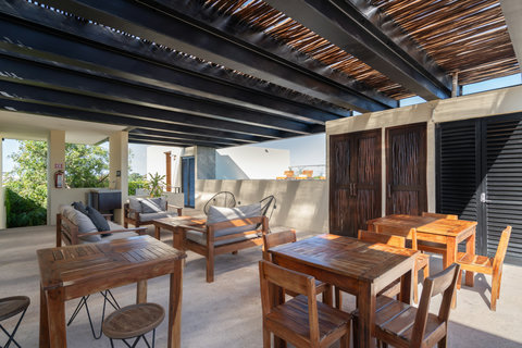 Enjoy a cozy lounge with warm wooden tables, comfortable chairs, and open space. Ideal for reading, working, or simply relaxing, this stylish area offers a calm and inviting atmosphere.