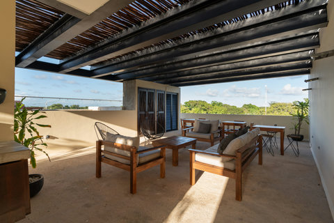 Enjoy a refreshing rooftop pool surrounded by comfy seating and open space. It’s an ideal place to unwind, read, or soak up the sun while taking in a peaceful and airy atmosphere.